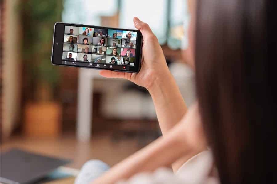 woman holding phone video call