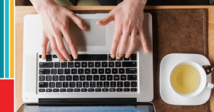 aerial photo of hands typing on laptop